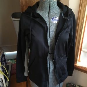 Long sleeve Nike jacket. Pull string hood.